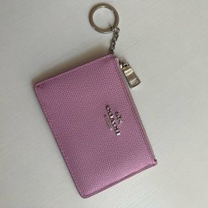 Coach’s pink wallet